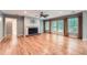 Spacious living room featuring hardwood floors, a fireplace, and bright natural light at 245 Sutallee Ridge Ne Ln, White, GA 30184