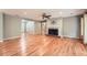 Elegant living area with a brick fireplace, hardwood floors, and neutral wall colors at 245 Sutallee Ridge Ne Ln, White, GA 30184