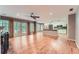 Open-concept living space with hardwood floors, fireplace, and access to the kitchen at 245 Sutallee Ridge Ne Ln, White, GA 30184