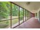 Screened-in porch provides views of the expansive wooded backyard, offering a relaxing outdoor living space at 245 Sutallee Ridge Ne Ln, White, GA 30184