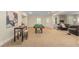 Spacious finished basement featuring a pool table and seating area for entertainment at 4457 Equity Ct, Ellenwood, GA 30294