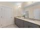 Bright bathroom with double sink vanity and granite countertops at 4457 Equity Ct, Ellenwood, GA 30294