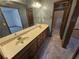 Bathroom showcasing double sink vanity, wallpaper, and a shower at 1471 Ashwood Way, Lawrenceville, GA 30043