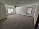 Spacious bedroom with neutral carpet, windows and a ceiling fan at 1471 Ashwood Way, Lawrenceville, GA 30043