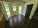 Sunlit breakfast nook features a white door to the backyard and backyard views at 1471 Ashwood Way, Lawrenceville, GA 30043