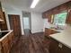 Cozy eat-in kitchen has warm cabinets and a view of the backyard at 1471 Ashwood Way, Lawrenceville, GA 30043