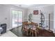 Dining area with wood floors and view of outdoor lounge and entertainment space at 2320 Boone Pl, Snellville, GA 30078