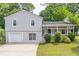 Charming home featuring a welcoming front porch and well-manicured lawn at 2320 Boone Pl, Snellville, GA 30078