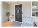 Charming front porch featuring a stylish black door and inviting decor at 2320 Boone Pl, Snellville, GA 30078
