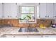 Kitchen with granite counters, a stainless sink and lots of light at 2320 Boone Pl, Snellville, GA 30078