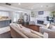 Open-concept living space with hardwood floors, fireplace, and natural light at 2320 Boone Pl, Snellville, GA 30078