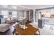 Combined kitchen, dining, and living area with lots of natural light, great for entertaining at 2320 Boone Pl, Snellville, GA 30078