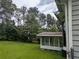 Enclosed porch at the back of the house with mature trees in the backyard at 345 Staten St, Jonesboro, GA 30238
