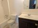 Bathroom features a standard toilet, vanity, mirror and shower-tub combo at 345 Staten St, Jonesboro, GA 30238