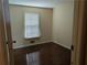 Bedroom with wood floor, neutral colored walls, and window with blinds at 345 Staten St, Jonesboro, GA 30238