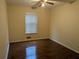 Bedroom featuring modern window and gleaming hardwood floors at 345 Staten St, Jonesboro, GA 30238