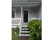 View of front entrance featuring a small porch and landscaping at 345 Staten St, Jonesboro, GA 30238