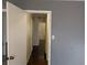 Hallway with hardwood floors, leading to rooms with neutral walls and white trim at 345 Staten St, Jonesboro, GA 30238