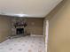 Living room featuring a stone fireplace and tile flooring at 345 Staten St, Jonesboro, GA 30238
