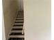 View of the staircase with carpeting, leading to the upper floor of the house at 345 Staten St, Jonesboro, GA 30238