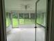 Bright sun room with multiple windows and a ceiling fan at 345 Staten St, Jonesboro, GA 30238