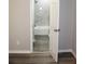 Bathroom features shower with grey tile surround and wood-look floors at 4059 Canby Ln, Decatur, GA 30035