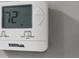 Close-up of a white thermostat with digital display reading 72 degrees, showing the cooling/heating system at 4059 Canby Ln, Decatur, GA 30035