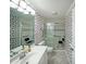Bright bathroom features floral wallpaper, walk in shower and a comfort height toilet at 1800 Clairmont Lk # 630, Decatur, GA 30033