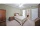Comfortable bedroom with classic wood furniture, neutral tones, and nearby bathroom access at 1800 Clairmont Lk # 630, Decatur, GA 30033