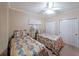 Bright bedroom features two twin beds, complemented by a ceiling fan and ample closet space at 1800 Clairmont Lk # 630, Decatur, GA 30033