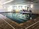 Bright indoor pool with ample natural light, tiled floors, and accessible features at 1800 Clairmont Lk # 630, Decatur, GA 30033