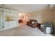 This open living room features an entertainment center, comfortable seating, and access to the dining area at 1800 Clairmont Lk # 630, Decatur, GA 30033