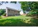 Spacious backyard with mature trees, a patio, and a lush lawn perfect for outdoor activities at 2113 Soque River Dr, Duluth, GA 30097