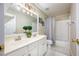 Bathroom featuring double sinks, generous vanity space, bathtub with shower and decorative fixtures at 2113 Soque River Dr, Duluth, GA 30097