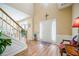 Bright foyer features hardwood floors, a staircase, and neutral wall colors at 2113 Soque River Dr, Duluth, GA 30097