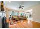 Bright living room with hardwood floors, fireplace, ceiling fan and easy access to the eat-in kitchen at 2113 Soque River Dr, Duluth, GA 30097