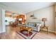 Cozy living room open to dining area, featuring hardwood floors and neutral decor at 2113 Soque River Dr, Duluth, GA 30097