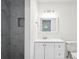 Modern bathroom with sleek vanity, stylish mirror, and marble-tiled shower at 329 Cranfill Se Rd, Marietta, GA 30060