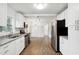 A sleek kitchen featuring stainless steel appliances, white cabinetry, and granite countertops at 329 Cranfill Se Rd, Marietta, GA 30060