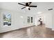 Open-concept living room boasting hardwood floors, a ceiling fan, and ample natural light at 329 Cranfill Se Rd, Marietta, GA 30060