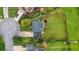 Bird's-eye view of a home featuring a well-manicured lawn and mature trees at 3340 Deerwood Ln, Rex, GA 30273
