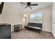Bedroom featuring neutral walls, a ceiling fan, a window, and a black futon at 3340 Deerwood Ln, Rex, GA 30273