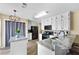 Bright kitchen with stainless steel appliances, granite countertops, and white cabinetry at 3340 Deerwood Ln, Rex, GA 30273