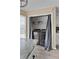 Convenient laundry closet located in kitchen featuring washer and dryer, granite countertop, and shelves at 3340 Deerwood Ln, Rex, GA 30273