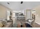 Inviting living room with bar seating, open to kitchen with hardwood floors and natural light at 3340 Deerwood Ln, Rex, GA 30273
