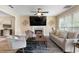 Bright living room with fireplace and ceiling fan, offers hardwood floors and comfortable seating at 3340 Deerwood Ln, Rex, GA 30273