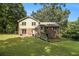 Expansive backyard with brick and siding exterior, plus a charming fenced yard at 4819 Elam Rd, Stone Mountain, GA 30083