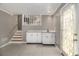 Finished basement area features a small bar with a sink and storage cabinets at 4819 Elam Rd, Stone Mountain, GA 30083