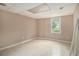 Unfinished basement space with a window, offering potential for customization at 4819 Elam Rd, Stone Mountain, GA 30083