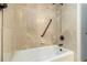 Bathroom bathtub with grab bar and shower head at 4819 Elam Rd, Stone Mountain, GA 30083
